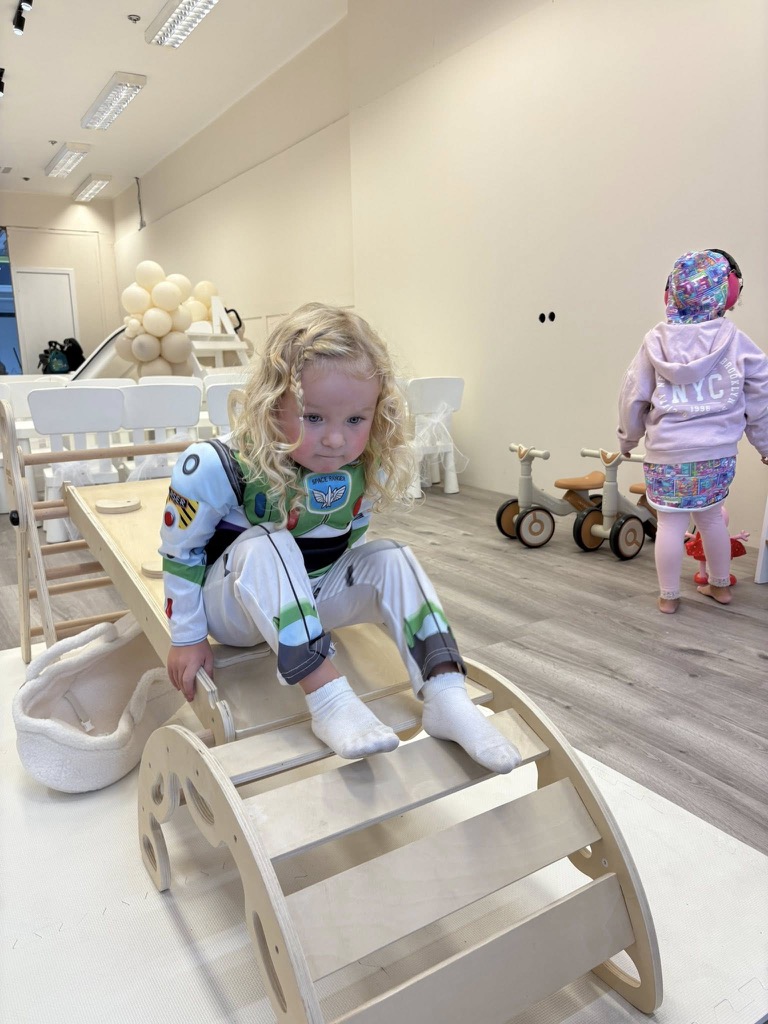Toddler enjoying interactive play area in Edinburgh