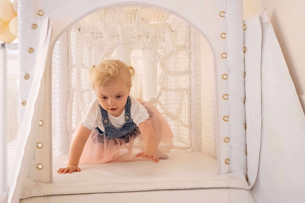 Toddler enjoying interactive play area in Edinburgh